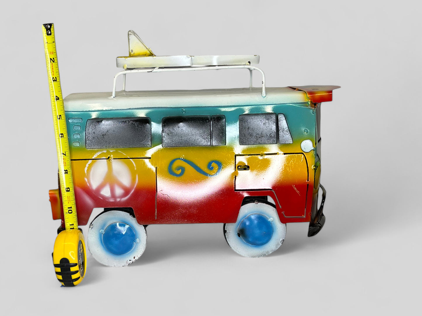 Colorful Hippie Metal Volkswagen truck with surfboard