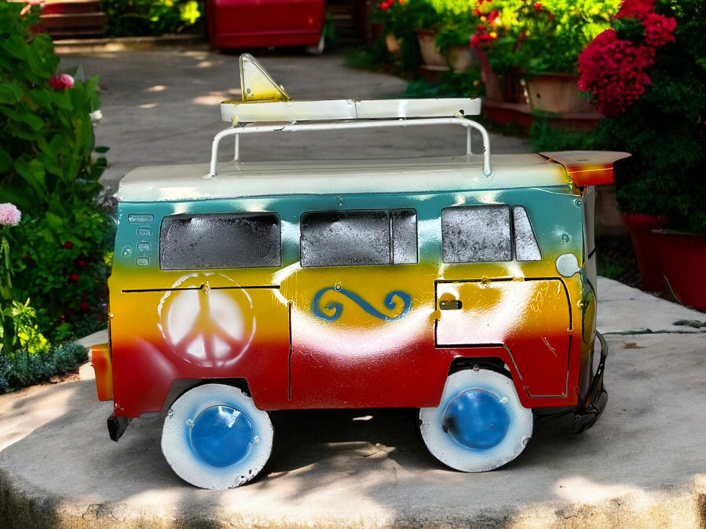 Colorful Hippie Metal Volkswagen truck with surfboard